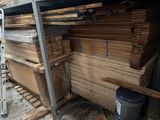 a pile of wood sitting on a pallet in a warehouse