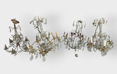 many chandeliers that are hanging on the wall