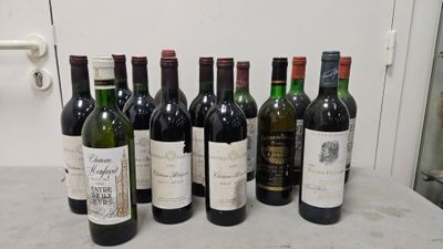 several bottles of wine are lined up on a counter