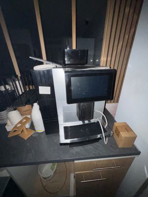 a coffee machine sitting on top of a kitchen counter