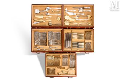many different types of silverware in a wooden box