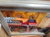 a picture of a painting of a street scene in a box