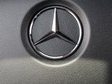 the steering wheel of a car with a mercedes logo on it
