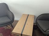 two chairs and a coffee table in a room