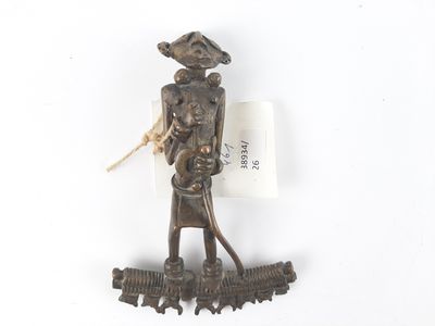 a bronze figurine of a woman holding a basket
