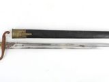 an old knife with a wooden handle and a brass handle