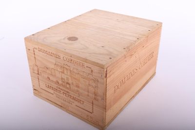 a wooden box that is sitting on a white surface