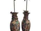 pair of oriental vases with flowers and birds on them on a white background