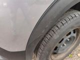 a close up of a car tire with a flat tire