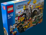 a box with a lego city set in it on a blue background