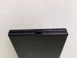 a close up of the back of a cell phone on a table