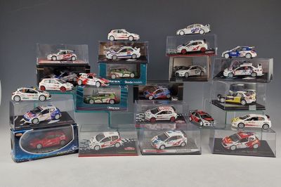 many different models of cars in display cases on a table