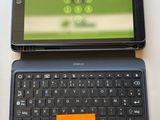 a laptop and a tablet on a table with a notepad