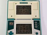 a small game console with a game on the screen