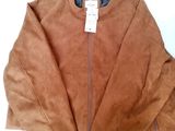 brown sued jacket with zippers and a tag on the back