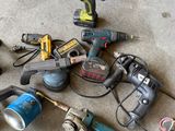 a lot of power tools that are on the floor