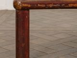 an image of a wooden bench on a tiled floor