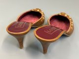 two pairs of shoes are sitting on top of a table