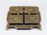 a black and gold box on a white surface