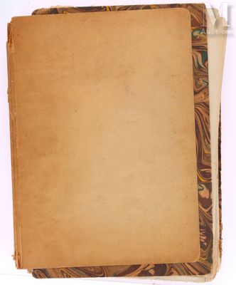 a close up of an old book with a piece of paper on top of it