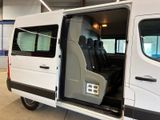 a white van with its doors open in a building