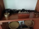a wooden shelf with a clock and some other items on it