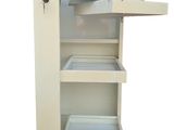 a small white cabinet with a drawer on wheels