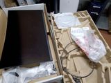 a box with a laptop and a monitor inside of it