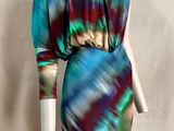 an image of a mannequin dressed in a multicolored dress