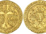 a gold coin with a crown on the front and a crown on the back