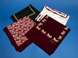 three different colored scarves on a blue background