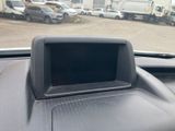 a picture of a car dashboard with a monitor in it