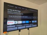 a flat screen tv mounted on the wall in a room
