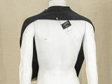 a mannequin wearing a black and white jacket on a mannequin