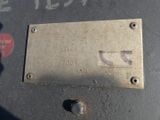 a close up of a metal plate on a machine