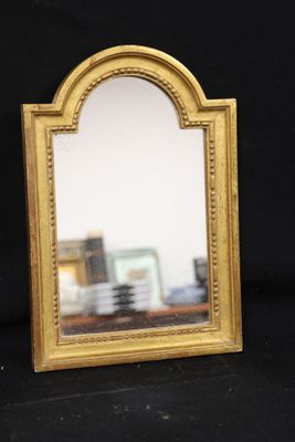 a small mirror that is sitting on a table