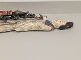 a figurine of a person laying on a table