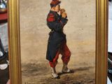 quelqu'un tient un tableau représentant un garçon avec un bonnet rouge