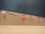 a cardboard box sitting on top of a wooden table