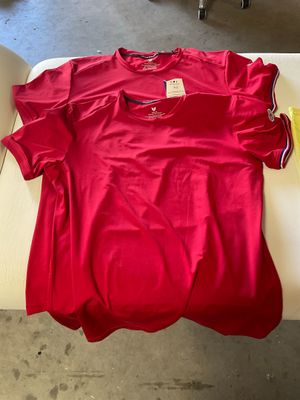 a red shirt sitting on a white table