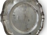 a silver plate that is sitting on a table