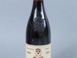 a picture of a bottle of red wine on a table