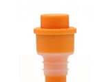 an orange and white cup with a plastic stopper on it