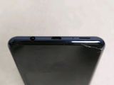 a close up of the back of a black phone