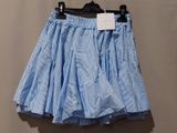 a blue and white striped skirt hanging on a hanger