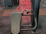 a gym room with a bench, weights, and other equipment