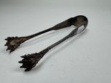 pair of antique silverware spoons on a white surface