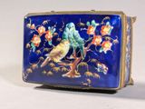 a blue purse with a bird and flowers on it