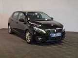 a picture of a small black car parked in a garage