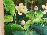 two paintings of flowers hanging on the wall